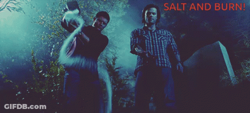 Two Men Standing Next To A Grave With The Words Salt And Burn GIF