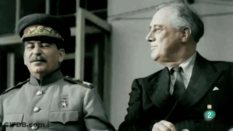 Two Men Standing Next To Each Other GIF