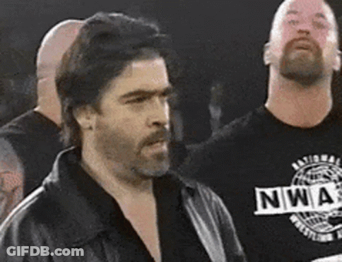 Two Men Standing Next To Each Other GIF