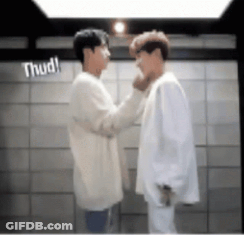 Two Men Standing Next To Each Other GIF