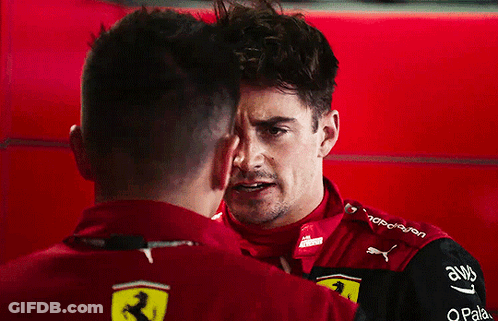 Two Men Standing Next To Each Other GIF