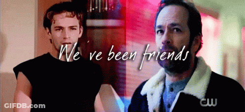 Two Men Standing Next To Each Other GIF