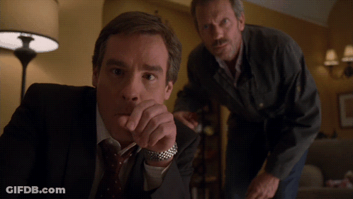 Two Men Standing Next To Each Other GIF