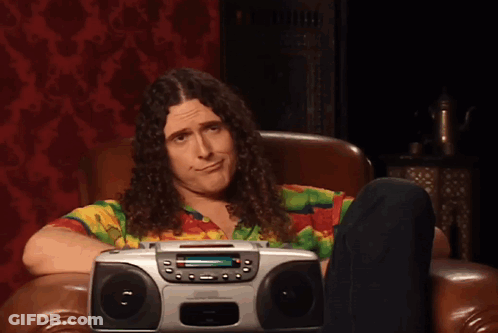 Two Men Standing Next To Each Other GIF