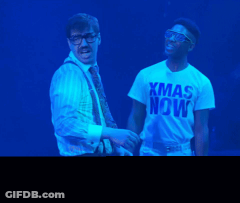 Two Men Standing Next To Each Other GIF