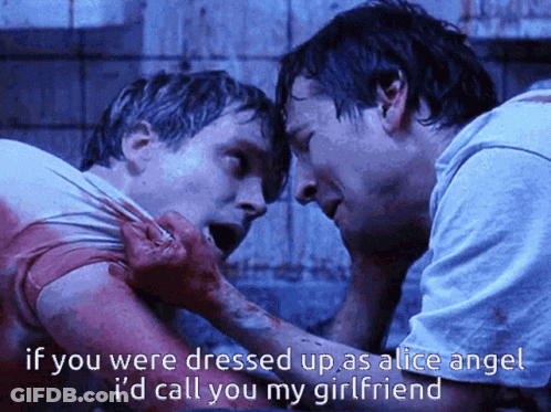 Two Men Standing Next To Each Other If You Were Dressed Up As Alice Angel GIF