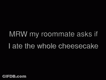 Two Men Standing Next To Each Other In A Dark Room GIF