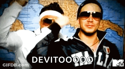 Two Men Standing Next To Each Other In Front Of A Map With The Words Devitooo On The Bottom GIF