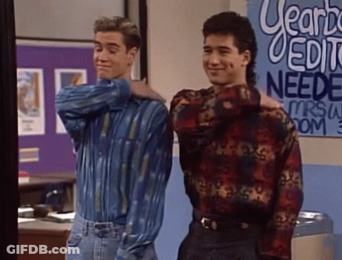 Two Men Standing Next To Each Other In Front Of A Sign That Says " Yearbook Editing Needs " GIF