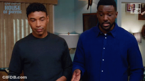 Two Men Standing Next To Each Other In Front Of A Wall That Says Tyler Perry 'S House Of Payne GIF