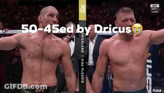 Two Men Standing Next To Each Other GIF