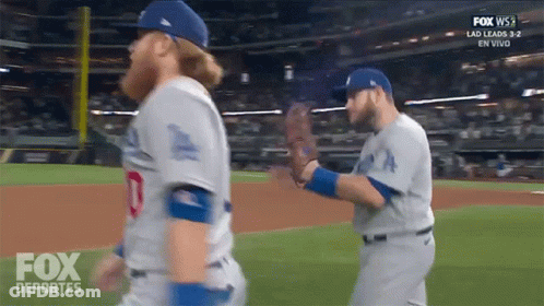 Two Men Standing Next To Each Other GIF
