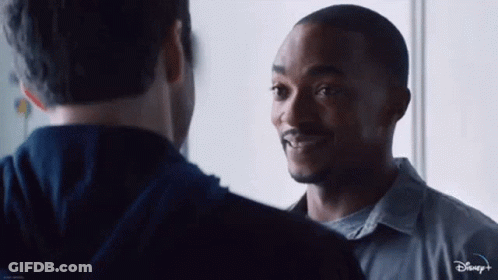 Two Men Standing Next To Each Other GIF