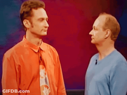 Two Men Standing Next To Each Other GIF