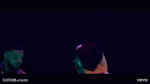 Two Men Standing Next To Each Other GIF