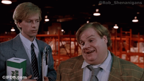 Two Men Standing Next To Each Other One Holding A Box Of Brad Pads GIF