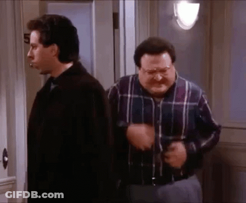 Two Men Standing Next To Each Other, One In Plaid Shirt GIF