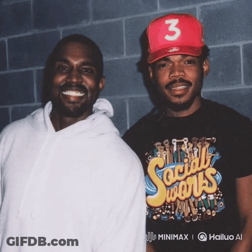Two Men Standing Next To Each Other One Wearing A Shirt That Says Social Works GIF