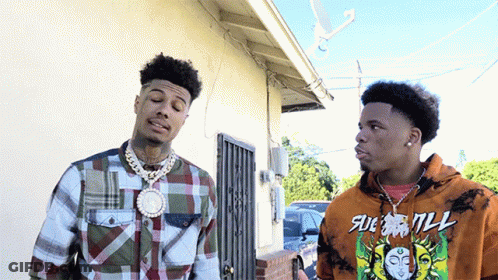 Two Men Standing Next To Each Other One Wearing Sue Will Hoodie GIF