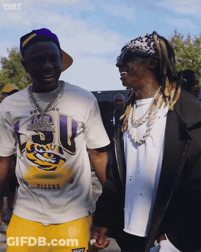 Two Men Standing Next To Each Other One Wearing Tigers Shirt GIF