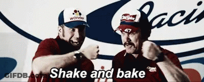 Two Men Standing Next To Each Other One Wearing Wonder Hat GIF