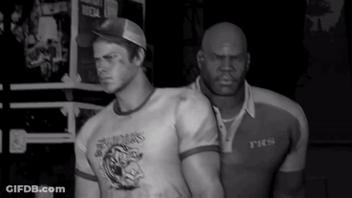 Two Men Standing Next To Each Other One Wearing YTCS Shirt GIF