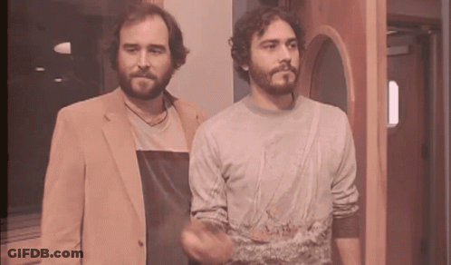 Two Men Standing Next To Each Other One With Beard GIF