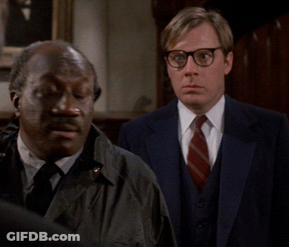 Two Men Standing Next To Each Other One With Glasses GIF