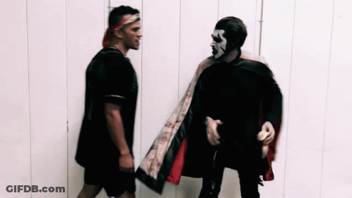 Two Men Standing Next To Each Other GIF