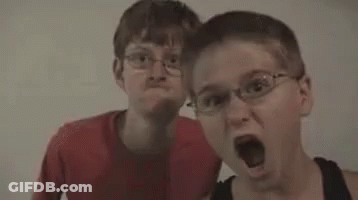 Two Men Standing Next To Each Other Popcorn GIF