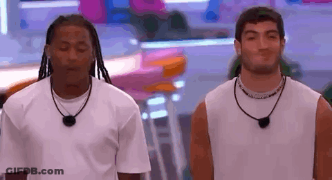 Two Men Standing Next To Each Other GIF