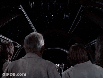 Two Men Standing Next To Each Other Saying Its Too Big To Be A Space Station GIF