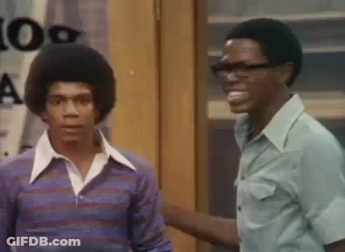 Two Men Standing Next To Each Other Smiling GIF