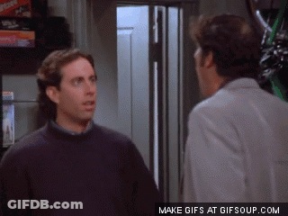 Two Men Standing Next To Each Other GIF