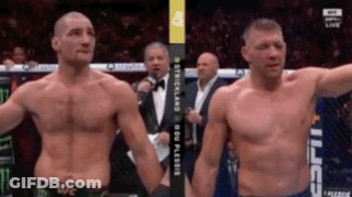Two Men Standing Next To Each Other GIF