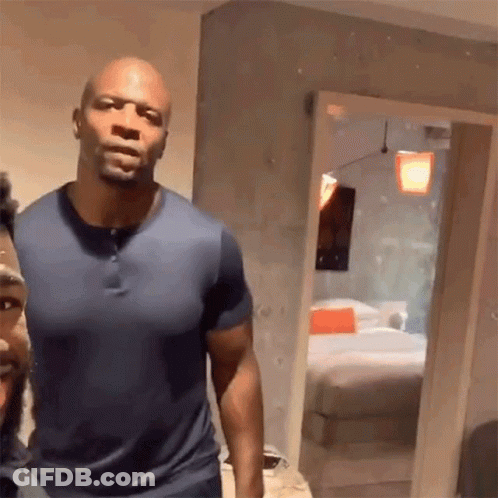Two Men Standing Next To Each Other GIF
