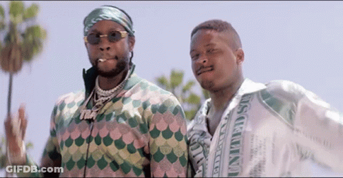 Two Men Standing Next To Each Other GIF
