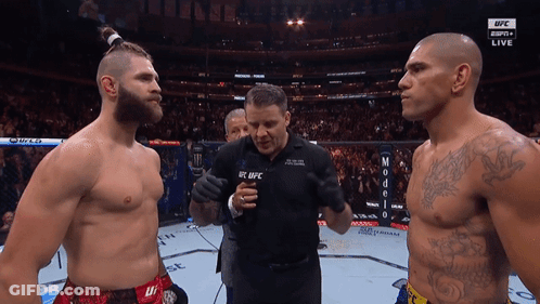Two Men Standing Next To Each Other With A Man Wearing A Shirt That Says Ufc On It GIF