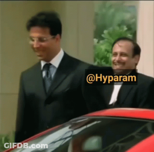 Two Men Standing Next To Each Other With A Sticker That Says @Hyparam GIF