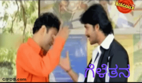 Two Men Standing Next To Each Other With Biscoot GIF