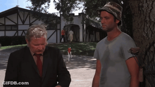 Two Men Standing Next To Each Other With Correct Me If I 'M Wrong Sandy Above Them GIF