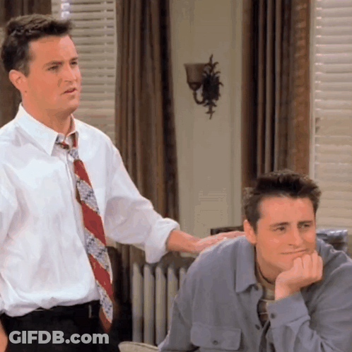 Two Men Standing Next To Each Other With Hand On Shoulder GIF