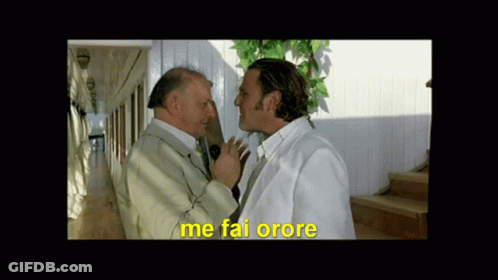 Two Men Standing Next To Each Other With Me Fai Orore In Yellow GIF