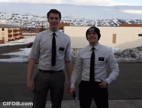 Two Men Standing Next To Each Other With One Wearing A Hat That Says ' I Love You ' GIF