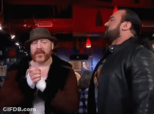 Two Men Standing Next To Each Other With The Word Banger On The Bottom Right GIF