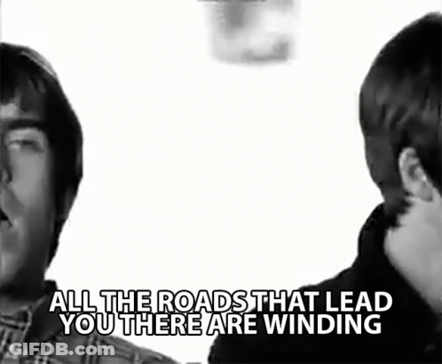 Two Men Standing Next To Each Other With The Words " All The Roads That Lead You There Are Winding " Above Them GIF