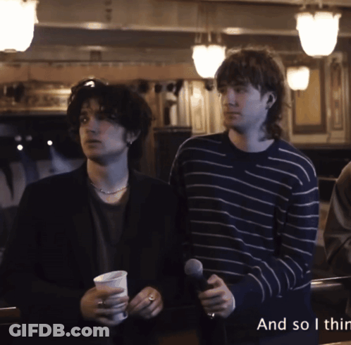 Two Men Standing Next To Each Other With The Words " And So I Thin " On The Bottom Right GIF