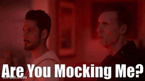 Two Men Standing Next To Each Other With The Words " Are You Mocking Me " On The Bottom GIF