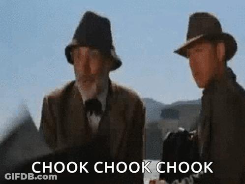 Two Men Standing Next To Each Other With The Words Chook Chook Chook Written On The Bottom GIF
