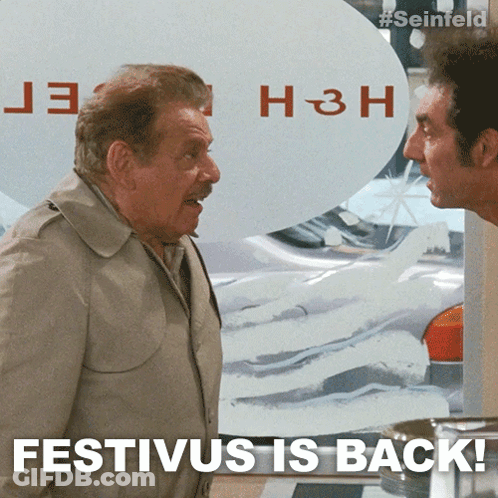 Two Men Standing Next To Each Other With The Words Festivus Is Back On The Bottom GIF
